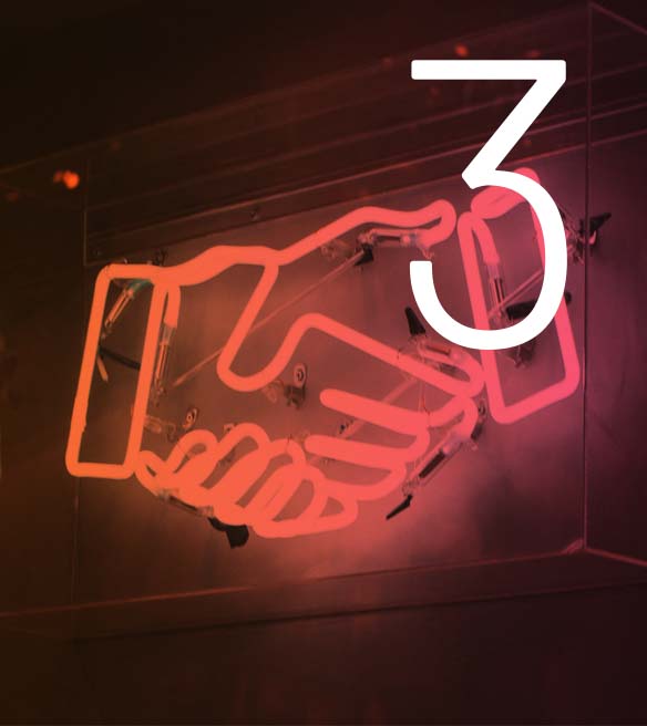 Icon of clasping hands made with neon lights